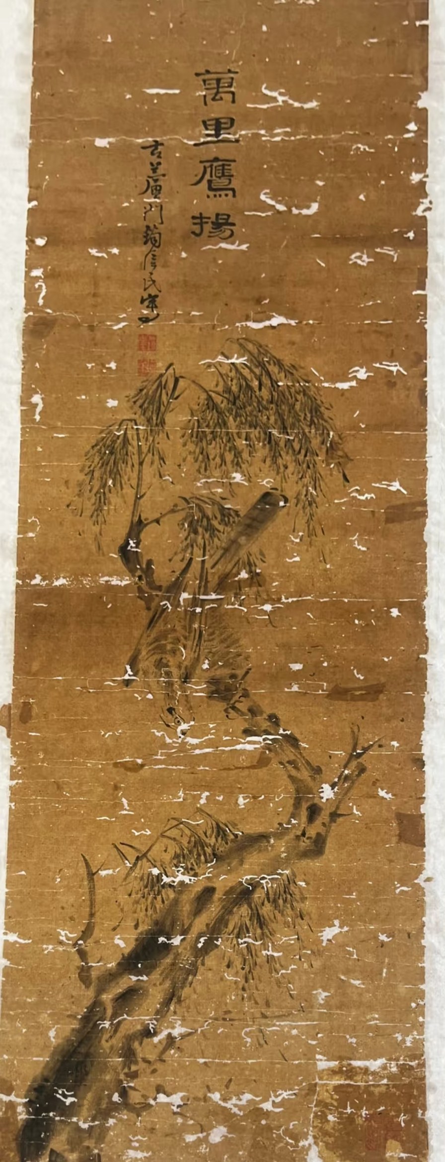 A traditional Chinese ink-wash painting of eagles in combat, visibly damaged with mould spots and missing areas.